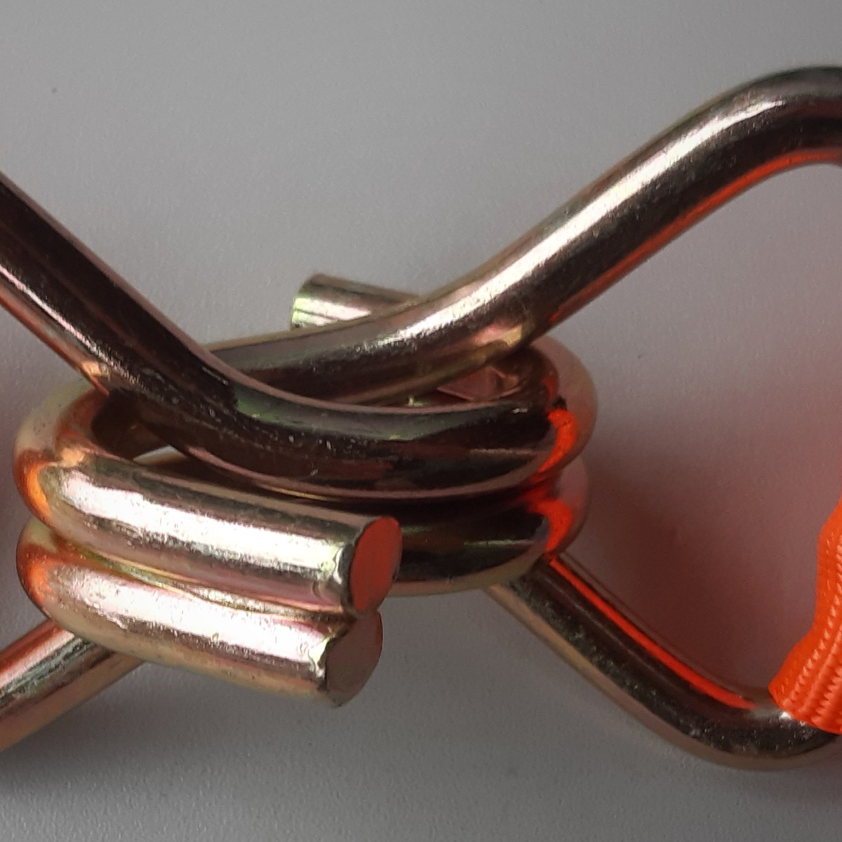Two steel strap hooks linked together
